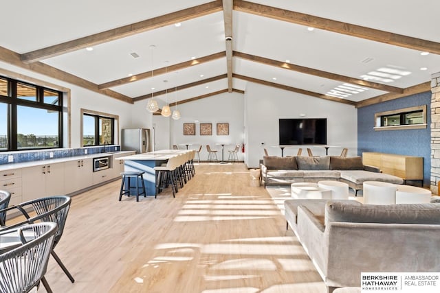 19014 Pratt Cir, Elkhorn, NE 68022 - living area with light wood finished floors, beamed ceiling, recessed lighting, and high vaulted ceiling