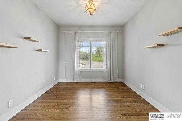 19014 Pratt Cir, Elkhorn, NE 68022 - spare room featuring wood finished floors and baseboards