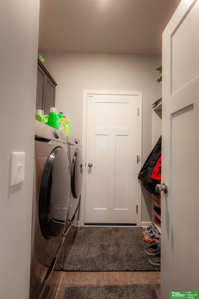 12210 Quail Dr, Bellevue, NE 68123 - laundry area with washing machine and dryer and cabinet space