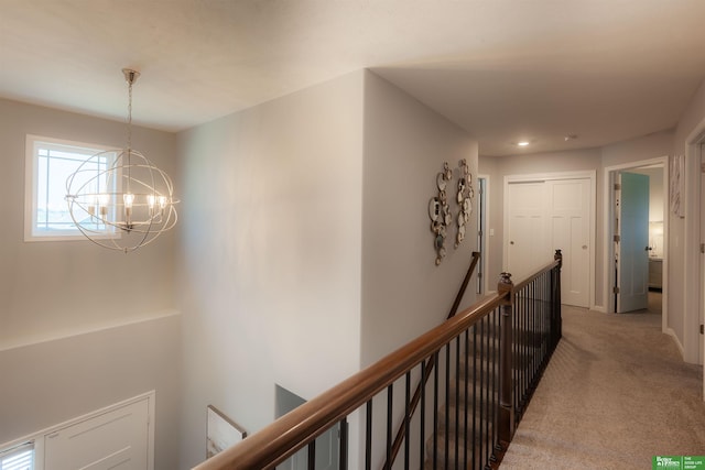 12210 Quail Dr, Bellevue, NE 68123 - corridor with an upstairs landing, carpet flooring, a chandelier, and recessed lighting