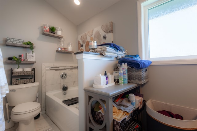 12210 Quail Dr, Bellevue, NE 68123 - bathroom with plenty of natural light, a tub to relax in, lofted ceiling, and marble look tile flooring