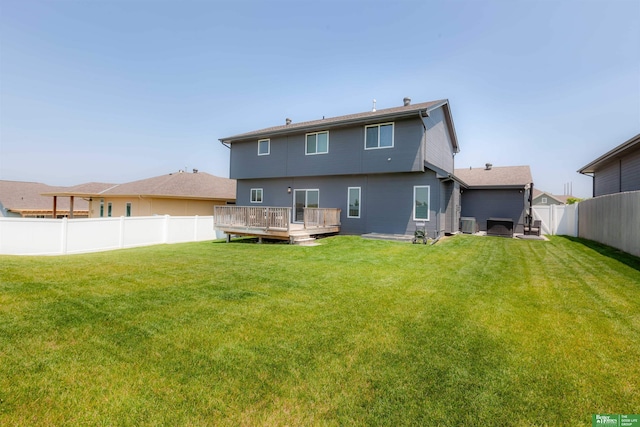 12210 Quail Dr, Bellevue, NE 68123 - rear view of property with a fenced backyard and a deck