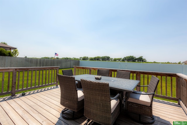 12210 Quail Dr, Bellevue, NE 68123 - wooden deck with a fenced backyard and outdoor dining area