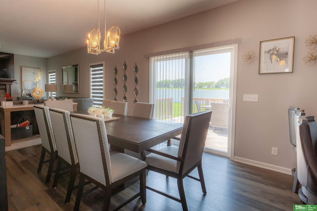 12210 Quail Dr, Bellevue, NE 68123 - dining room featuring a chandelier and dark wood finished floors