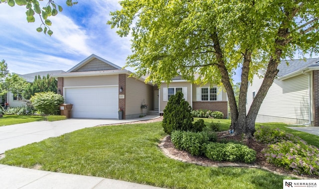 1933 Redstone Rd, Lincoln, NE 68521 - view of front of home with brick siding, a garage, concrete driveway, and a front lawn
