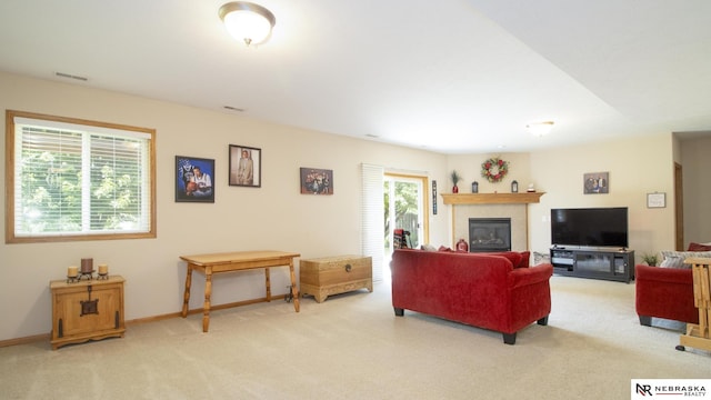 1933 Redstone Rd, Lincoln, NE 68521 - carpeted living area with a glass covered fireplace and baseboards