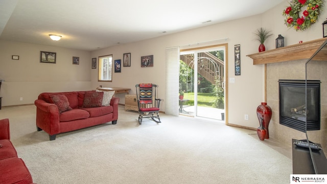 1933 Redstone Rd, Lincoln, NE 68521 - carpeted living room with a tiled fireplace and baseboards