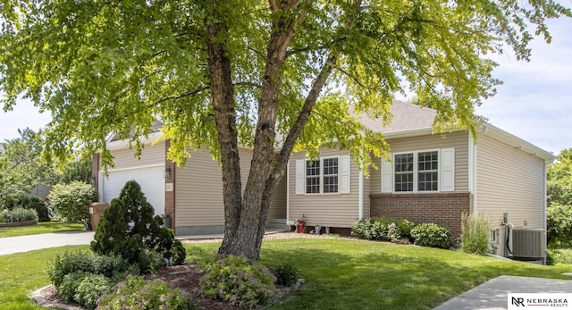 1933 Redstone Rd, Lincoln, NE 68521 - view of property hidden behind natural elements with brick siding and a front yard