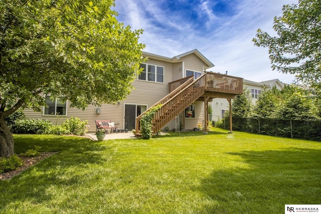 1933 Redstone Rd, Lincoln, NE 68521 - rear view of house featuring stairway, a wooden deck, and a patio area