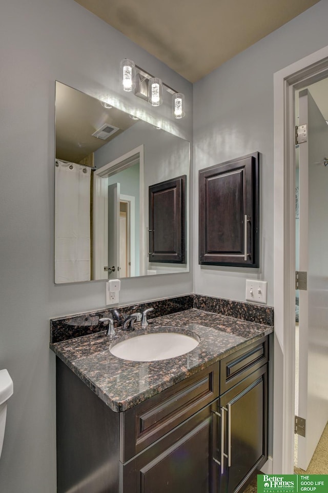 444 Riverfront Plz Unit 501, Omaha, NE 68102 - bathroom featuring vanity and toilet