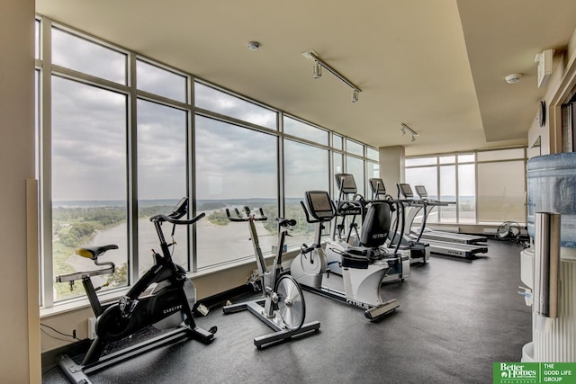 444 Riverfront Plz Unit 501, Omaha, NE 68102 - workout area featuring a wall of windows and rail lighting