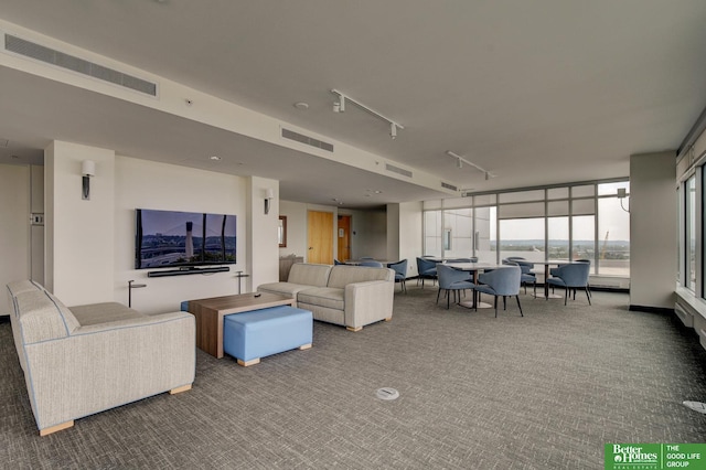 444 Riverfront Plz Unit 501, Omaha, NE 68102 - carpeted living area featuring rail lighting