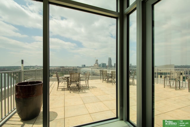 444 Riverfront Plz Unit 501, Omaha, NE 68102 - doorway with plenty of natural light, tile patterned flooring, expansive windows, and a city view