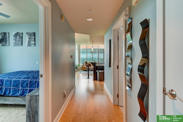 444 Riverfront Plz Unit 501, Omaha, NE 68102 - hallway featuring wood-type flooring and baseboards