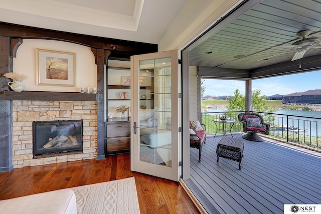 820 N 100th St, Lincoln, NE 68527 - doorway with a water view, hardwood / wood-style floors, ceiling fan, plenty of natural light, and crown molding