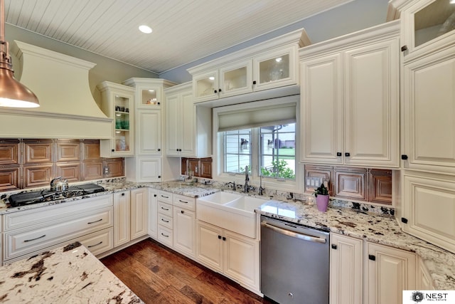 820 N 100th St, Lincoln, NE 68527 - kitchen featuring appliances with stainless steel finishes, dark wood-type flooring, decorative backsplash, premium range hood, and light stone counters