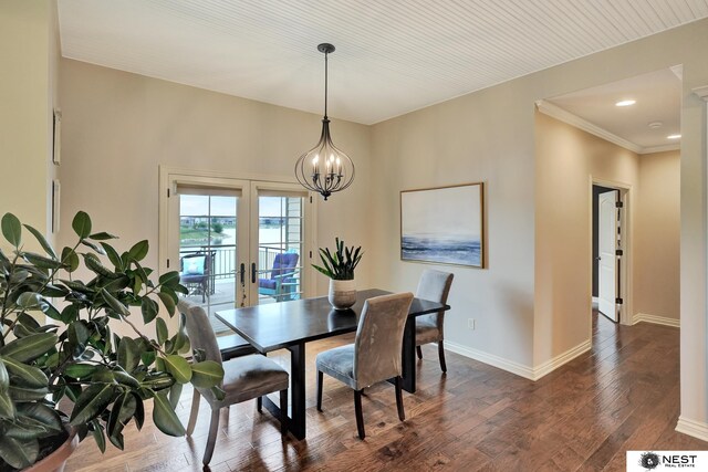 820 N 100th St, Lincoln, NE 68527 - dining area with dark wood-style floors, a chandelier, french doors, and ornamental molding
