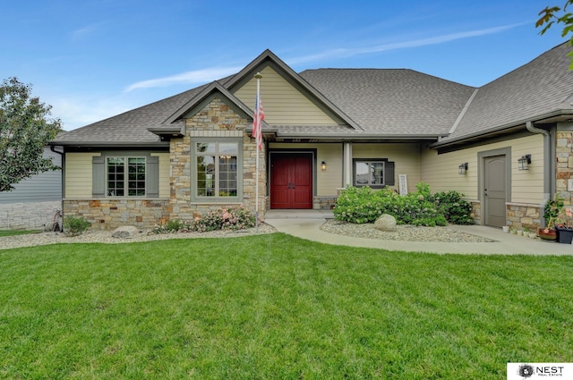 820 N 100th St, Lincoln, NE 68527 - craftsman-style house featuring stone siding, a shingled roof, and a front yard