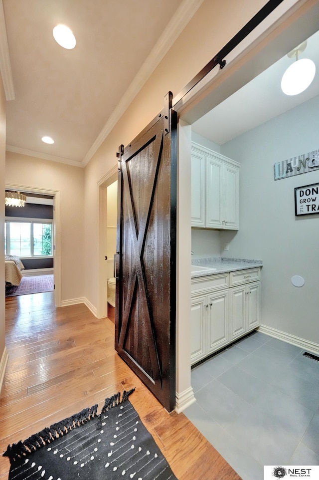 820 N 100th St, Lincoln, NE 68527 - bathroom featuring vanity, crown molding, wood finished floors, and recessed lighting