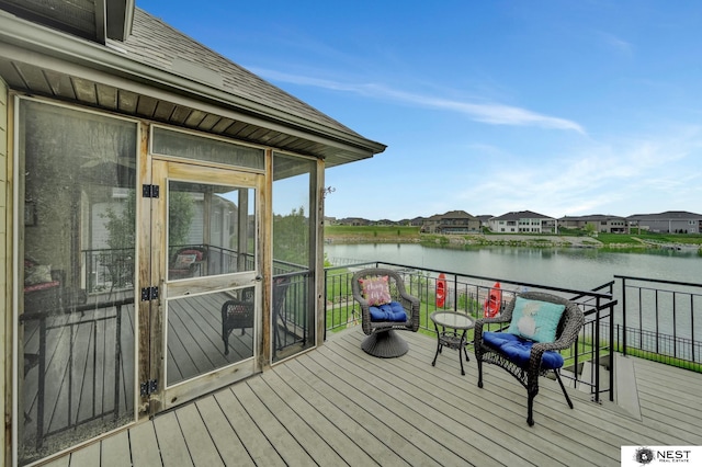 820 N 100th St, Lincoln, NE 68527 - wooden terrace featuring a water view, a sunroom, and a residential view
