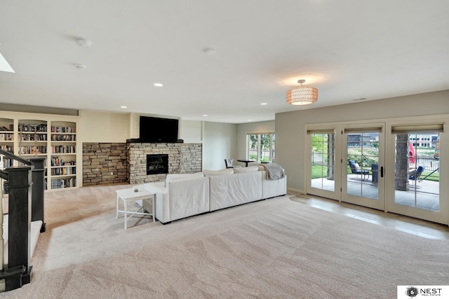 820 N 100th St, Lincoln, NE 68527 - living room with a stone fireplace, recessed lighting, and carpet floors