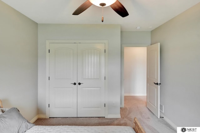 820 N 100th St, Lincoln, NE 68527 - unfurnished bedroom featuring light carpet, a closet, and ceiling fan