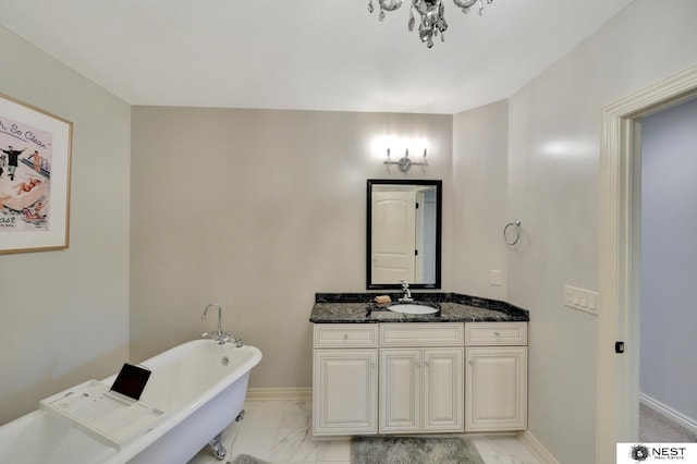 820 N 100th St, Lincoln, NE 68527 - bathroom with a freestanding bath, vanity, marble look tile flooring, and a chandelier