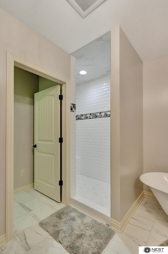 820 N 100th St, Lincoln, NE 68527 - bathroom featuring marble look tile flooring, tiled shower, and a freestanding bath