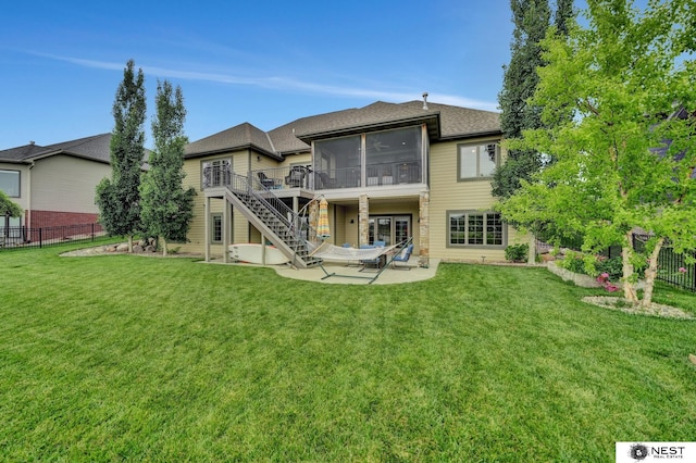 820 N 100th St, Lincoln, NE 68527 - rear view of property featuring a sunroom, a patio, stairway, and a wooden deck
