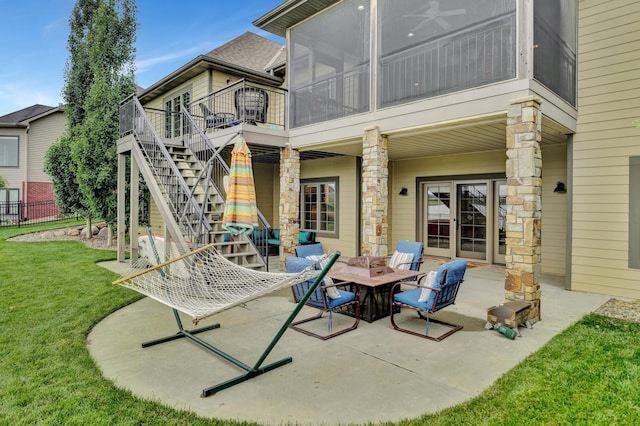 820 N 100th St, Lincoln, NE 68527 - view of patio / terrace with a fire pit, a sunroom, stairway, and a deck