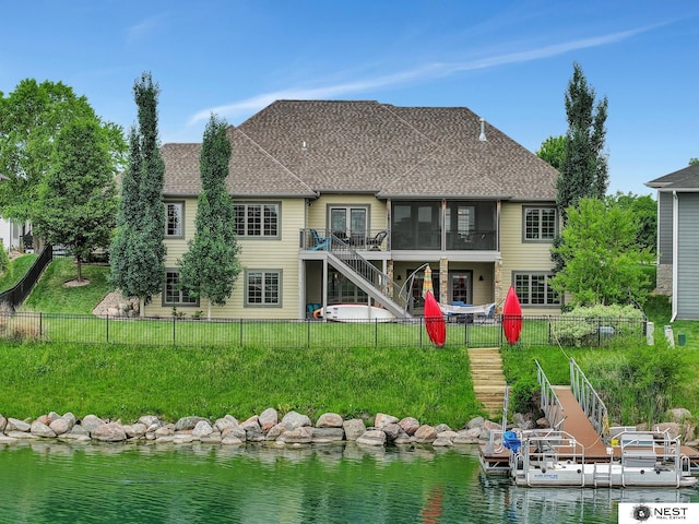 820 N 100th St, Lincoln, NE 68527 - back of house with stairway, a fenced backyard, a water view, and a shingled roof