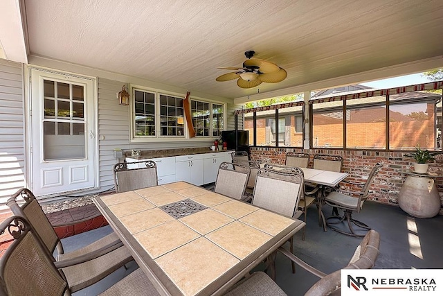 1817 Holling Dr, Omaha, NE 68144 - view of patio / terrace featuring outdoor dining space and ceiling fan