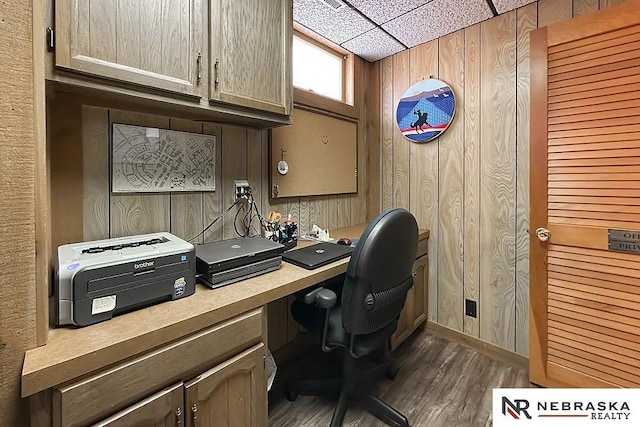 1817 Holling Dr, Omaha, NE 68144 - office area featuring wood walls, dark wood-style flooring, and a paneled ceiling