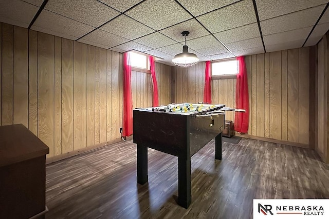 1817 Holling Dr, Omaha, NE 68144 - game room with wood finished floors, wooden walls, and a drop ceiling