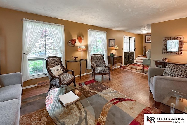 1817 Holling Dr, Omaha, NE 68144 - living room with wood finished floors and baseboards