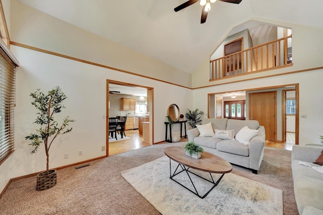 4630 Eagle Ridge Rd, Lincoln, NE 68516 - carpeted living room with ceiling fan and high vaulted ceiling
