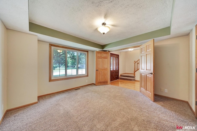 4630 Eagle Ridge Rd, Lincoln, NE 68516 - unfurnished bedroom featuring light carpet and a textured ceiling