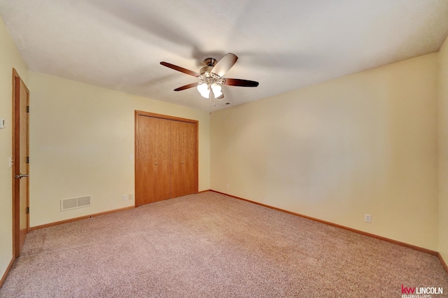 4630 Eagle Ridge Rd, Lincoln, NE 68516 - unfurnished bedroom featuring carpet flooring, a closet, and a ceiling fan