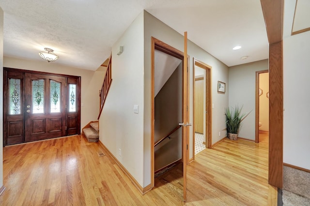 4630 Eagle Ridge Rd, Lincoln, NE 68516 - entryway with light wood finished floors and stairs