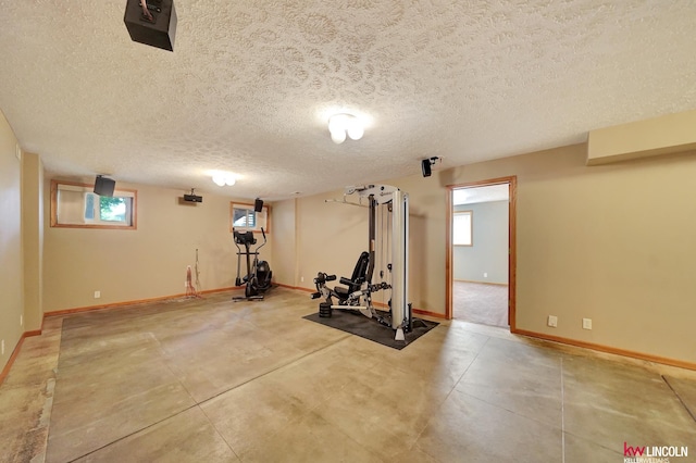 4630 Eagle Ridge Rd, Lincoln, NE 68516 - exercise area featuring baseboards and a textured ceiling