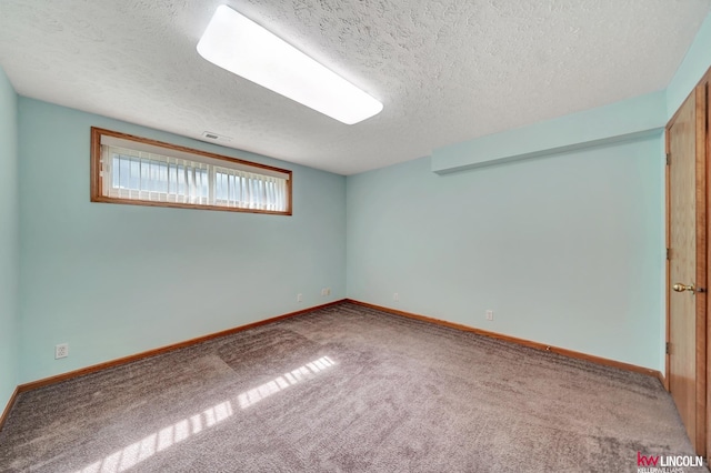 4630 Eagle Ridge Rd, Lincoln, NE 68516 - carpeted empty room featuring a textured ceiling and baseboards