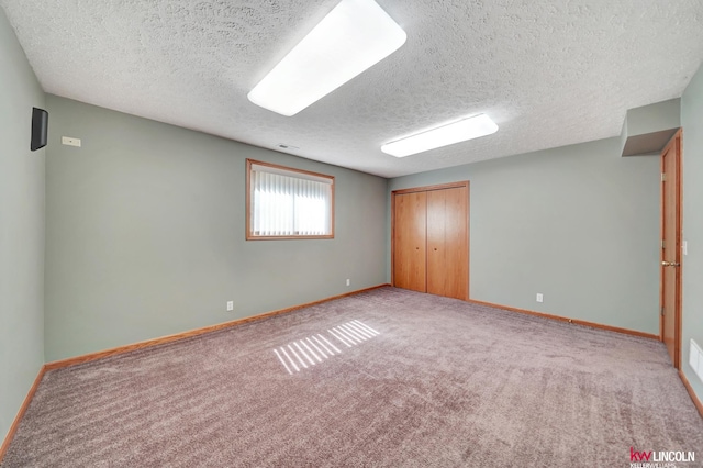 4630 Eagle Ridge Rd, Lincoln, NE 68516 - unfurnished bedroom featuring a textured ceiling, carpet floors, and a closet