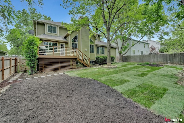 4630 Eagle Ridge Rd, Lincoln, NE 68516 - rear view of house featuring a fenced backyard, a wooden deck, and stairway