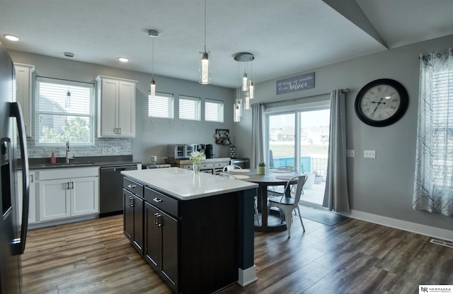 7342 S 184th St, Omaha, NE 68136 - kitchen with stainless steel appliances, healthy amount of natural light, white cabinetry, dark wood-style flooring, and recessed lighting