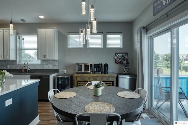 7342 S 184th St, Omaha, NE 68136 - dining area featuring healthy amount of natural light, dark wood-style floors, a chandelier, and recessed lighting
