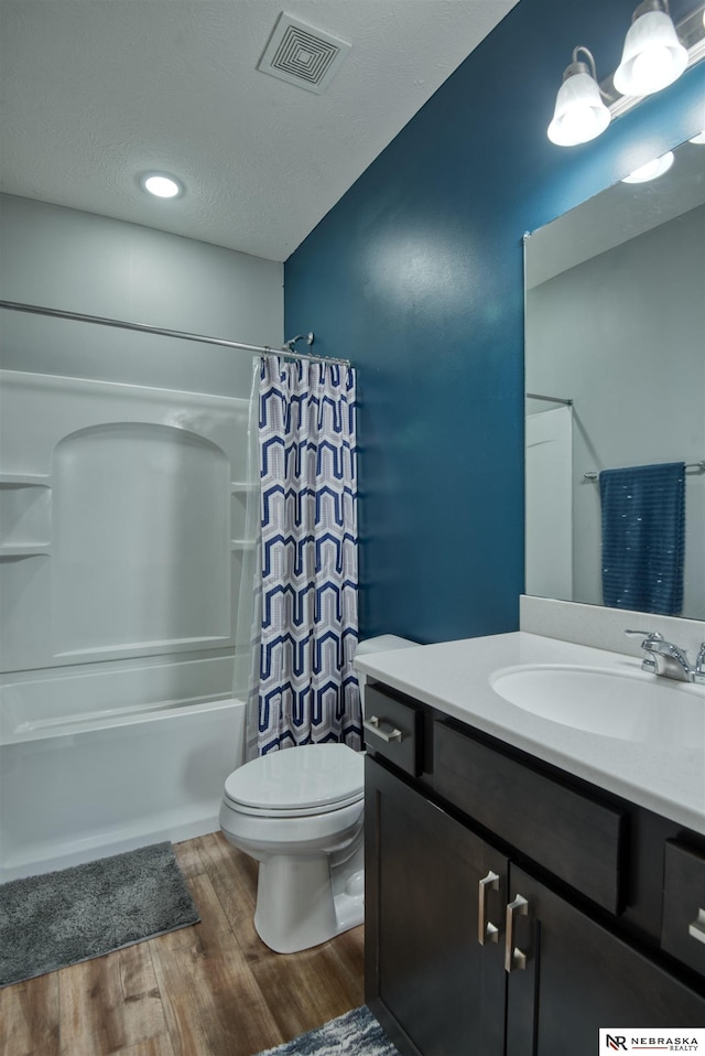 7342 S 184th St, Omaha, NE 68136 - bathroom featuring wood finished floors, vanity, and shower / bath combo with shower curtain