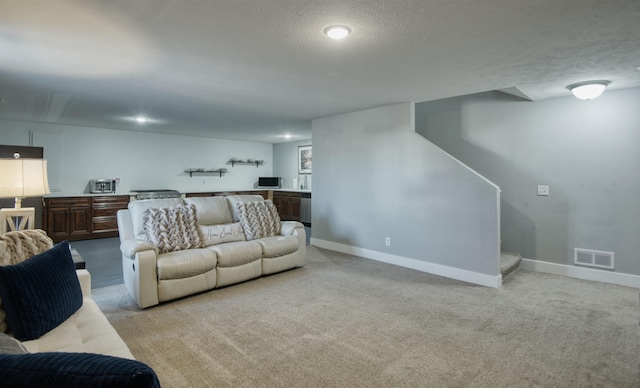 7342 S 184th St, Omaha, NE 68136 - living room with light colored carpet, a textured ceiling, stairs, and recessed lighting