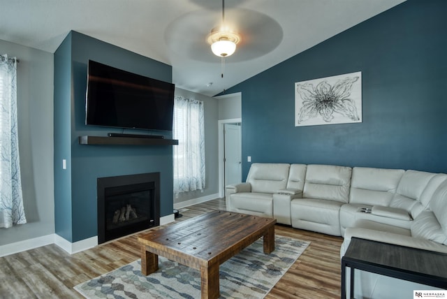 7342 S 184th St, Omaha, NE 68136 - living room with lofted ceiling, ceiling fan, wood finished floors, and a fireplace
