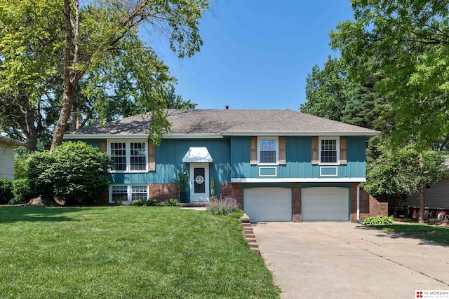 622 S 126th St, Omaha, NE 68154 - raised ranch featuring brick siding, concrete driveway, a garage, a front yard, and a shingled roof