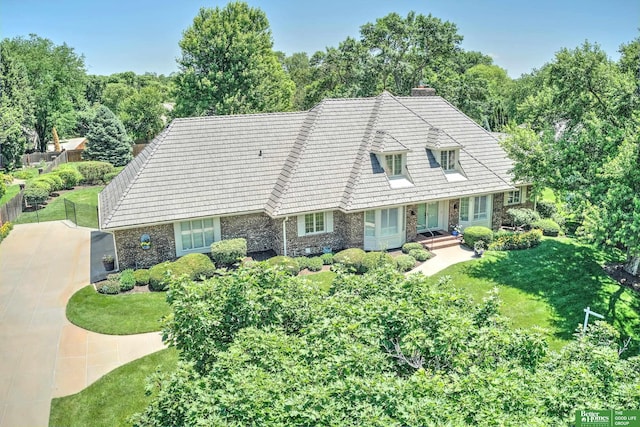 9706 Ascot Dr, Omaha, NE 68114 - cape cod home with stone siding and a chimney